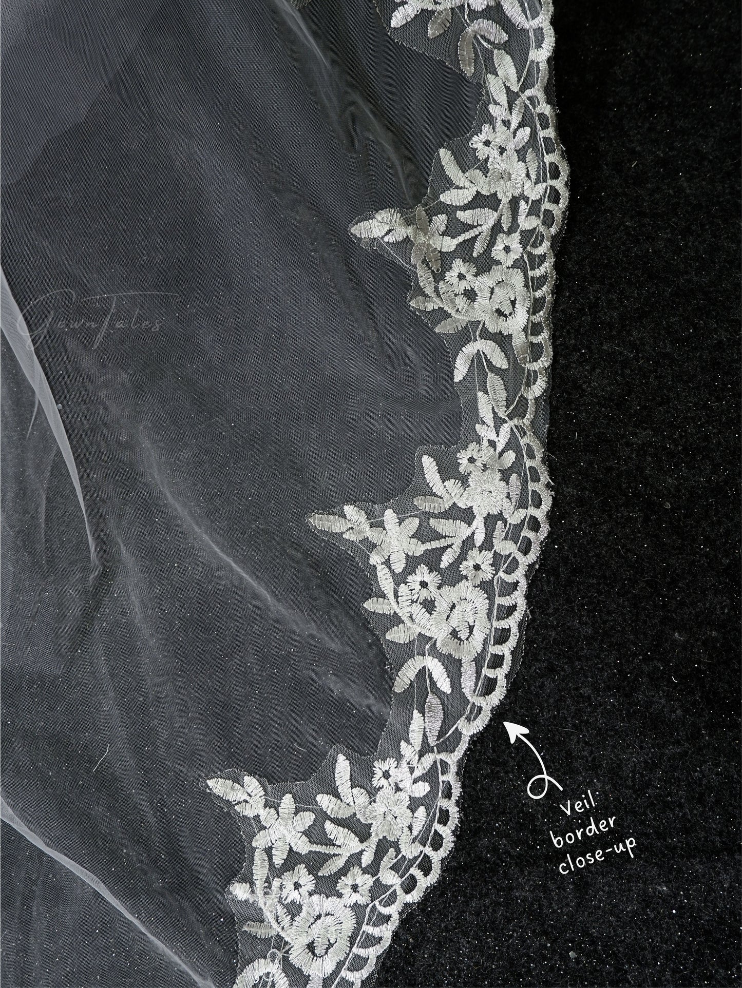 white floor length lace veil border close-up view