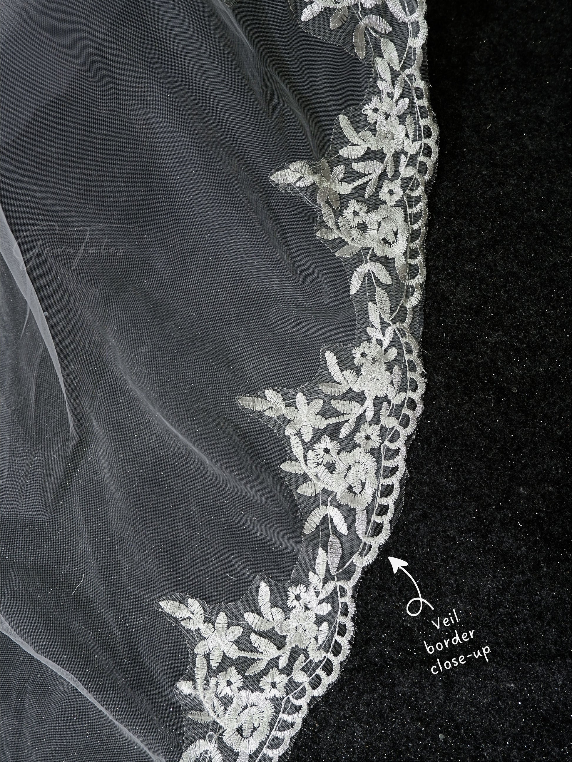 white floor length lace veil border close-up view