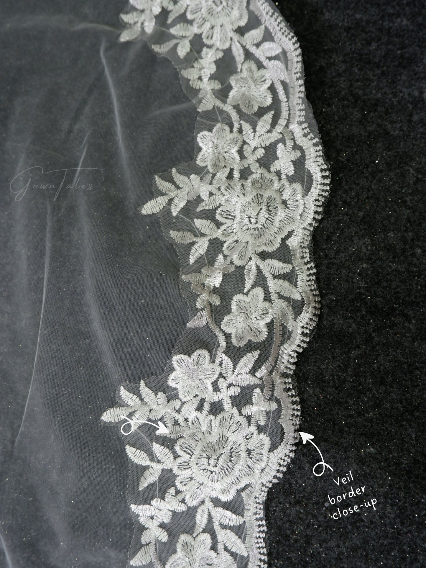white floor length lace veil border close-up view