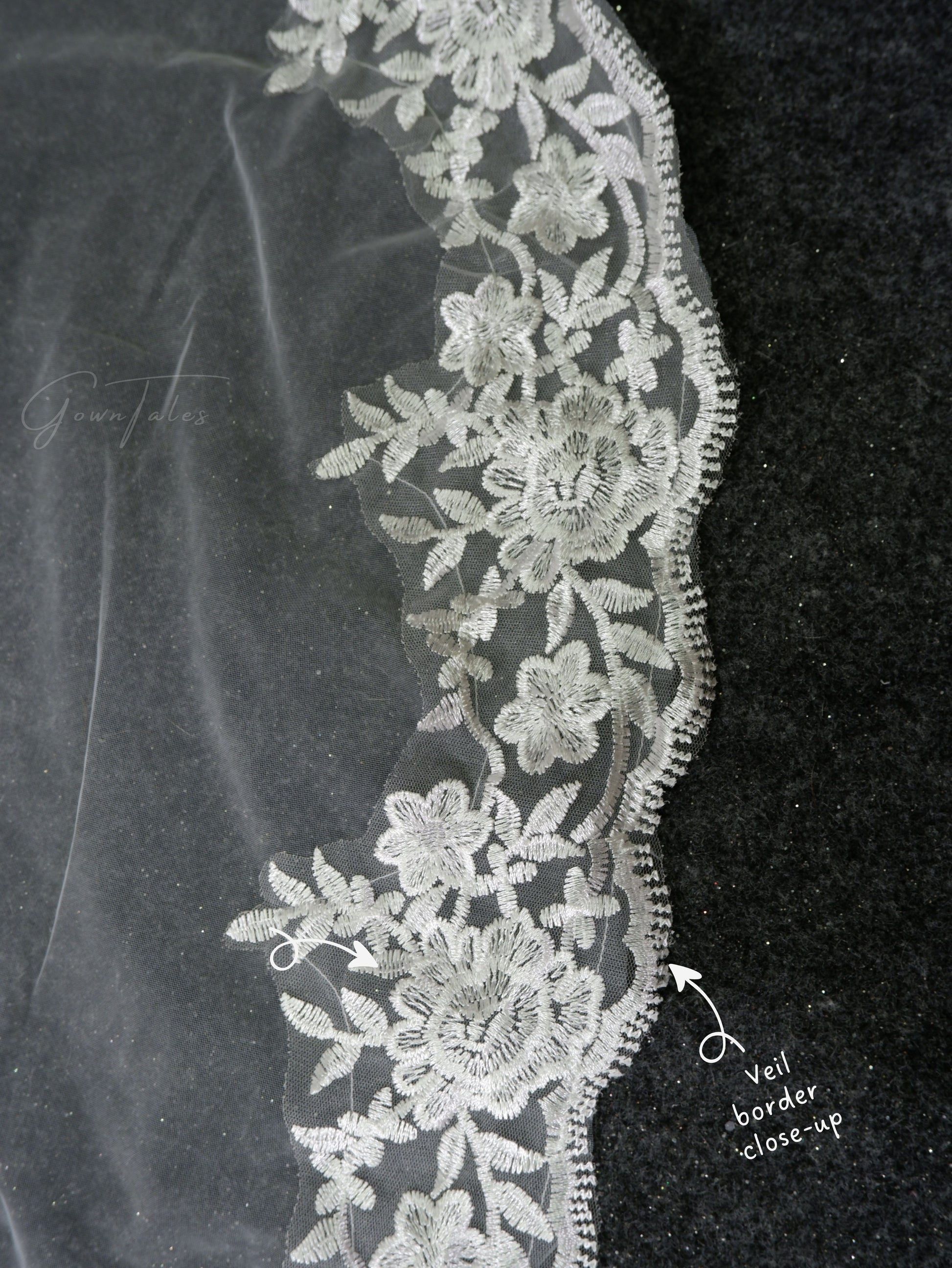 white floor length lace veil border close-up view